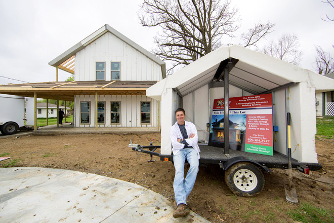 Jimmy Rapert in the front yard of an energy-efficient, EPS-using 1,700-SF home he is building in Johnson (Washington County).