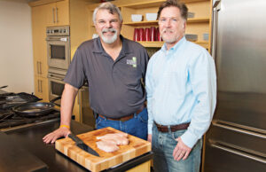 Ed Fryar, CEO of Ozark Mountain Poultry, left, with CFO Terry King in the corporate offices of the Rogers company, which generated $250 million in revenue in 2014 and employs about 1,300.