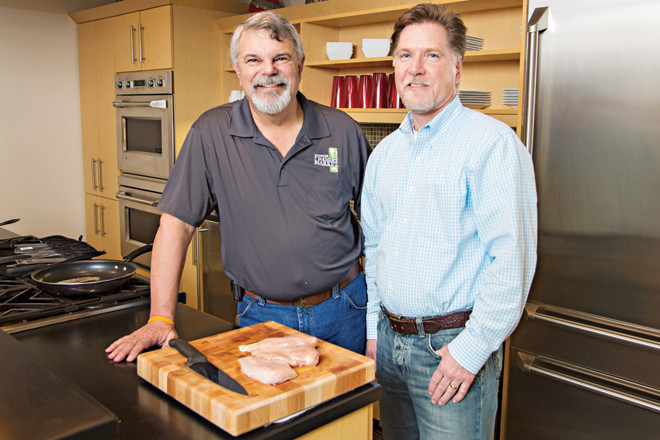 Ed Fryar, CEO of Ozark Mountain Poultry, left, with CFO Terry King in the corporate offices of the Rogers company, which generated $250 million in revenue in 2014 and employs about 1,300.