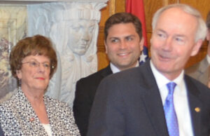 Sen. Jane English (R-North Little Rock) looks on with Senate President Pro Tempore Jonathan Dismang (R-Searcy) as Gov. Asa Hutchinson makes remarks after signing a series of workforce education bills into law.