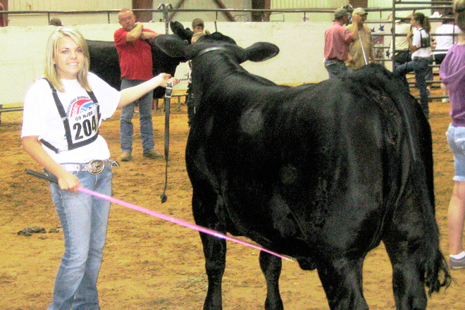 Magnolia’s Victoria Maloch, grooming her prize bull, will be the first female from Arkansas to serve as national FFA officer as she takes the organization’s national secretary post.
