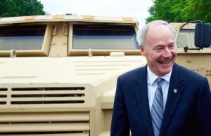 Gov. Asa Hutchinson with one of Lockheed Martin's Joint Light Tactical Vehicles.