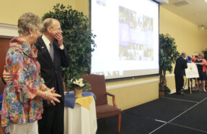 Outgoing SAU President David Rankin and his wife Toni react to the announcement that the university's College of Business would be named after him.