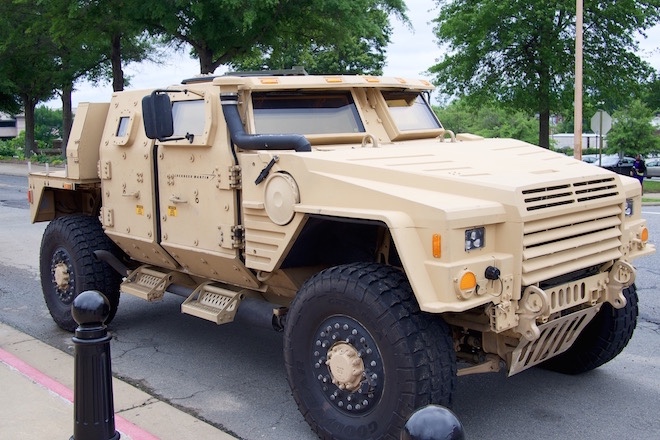 Gov. Asa Hutchinson and officials with Lockheed Martin show off the company's Joint Light Tactical Vehicle.