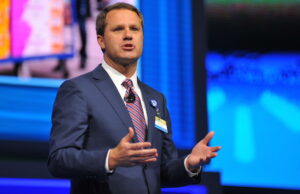 Wal-Mart CEO Doug McMillon says the retailer is already seeing benefits from raising worker pay.