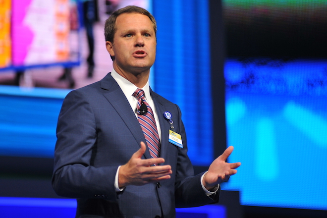 Wal-Mart CEO Doug McMillon says the retailer is already seeing benefits from raising worker pay.