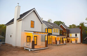 The Black Apple Community’s pocket neighborhood, in Bentonville, features 11 residences, a common courtyard and a common-use building. Christy Walton hired the Virginia firm GreenSpur to design the community.