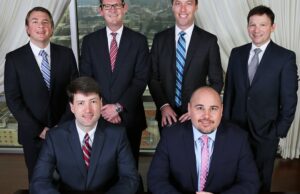 The attorneys of Steel, Wright & Collier: (top row, from left) Winston Collier, Marshall Wright, Nate Steel, Scott Poynter, (seated, from left) Alex Gray and Jeremy Hutchinson.