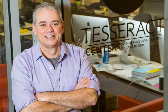 Dave Fredrick stands outside the Tesseract Center on the University of Arkansas campus.  “This is going to be ubiquitous,” he says of game design.