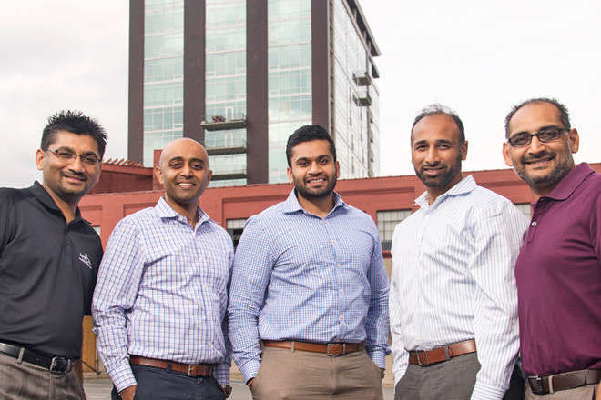 At the Hilton Garden Inn site are Chet Patel, Pinnacle Hotel Group president; Shawn Govind, director of development; Roshan Patel, development coordinator; Rocky Govind, director of construction and asset management; and Nayan Nagin, director of purchasing and procurement.