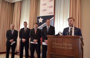 Engage Cuba President James Williams&nbsp;speaks as (from left)&nbsp;Juan Lamigueiro Leon, deputy chief of mission for the Cuban&nbsp;Embassy in the United States; Arkansas Secretary of Agriculture&nbsp;Wes Ward;&nbsp;Robert Moery, liaison to the governor and USA Rice Chairman&nbsp;Dow Brantley await their turn to at the podium during a press conference Monday morning.