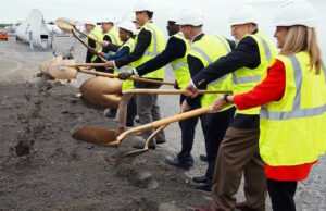 Company officials and representatives from the city of Little Rock the Little Rock Regional Chamber break ground on a 44,000-SF warehouse for LM Wind Power at Little Rock Port.