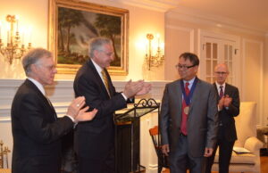 Hong-yu Li (third from left), a professor at the University of Arkansas for Medical Sciences, is named a Arkansas Research Alliance scholar by and accepts the Helen Adams & Arkansas Research Alliance (ARA) Endowed Chair from ARA President and Chieft Executive Officer Jerry Adams (from left), UAMS Chancellor Dr. Dan Rahn and UAMS College of Pharmacy Dean Keith Olsen. &nbsp;