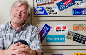 The bumper stickers on David Couch&rsquo;s file cabinets provide hints as to his political leanings.
