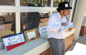 Glen Schwarz gathers petition signatures in Little Rock’s River Market to put proposed amendments  to the Arkansas Constitution on the Nov. 8 ballot.