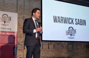 Warwick Sabin speaking during demo day at the Arkansas Regional Innovation Hub in North Little Rock.