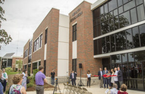 Steve Beers, vice president of student development, Chip Pollard, university president, Ellen Odell, director of nursing, Anna Klein, junior nursing major, Jeff Terrell, dean of the college of education and human services, and Jim Krall, vice president of advancement, cut the ribbon, officially opening JBU&rsquo;s Health Education Building on Monday.