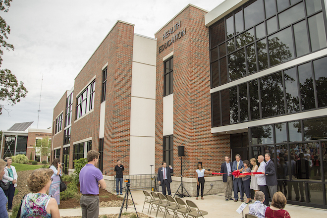 Steve Beers, vice president of student development, Chip Pollard, university president, Ellen Odell, director of nursing, Anna Klein, junior nursing major, Jeff Terrell, dean of the college of education and human services, and Jim Krall, vice president of advancement, cut the ribbon, officially opening JBU&rsquo;s Health Education Building on Monday.