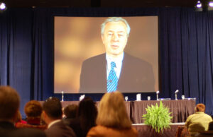 Wells Fargo President and CEO John Stumpf appears via video at a Charlotte, North Carolina, conference in 2006.