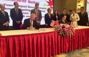 Gov. Asa Hutchinson signs a memoradum of understanding with&nbsp;Suzhou Industrial Park Tianyuan Garment Co. in China. The company plans to&nbsp;invest $20 million in a Little Rock plant that will employ 400 people.