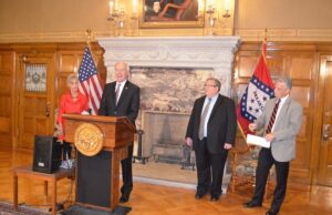 From left, War Memorial Stadium Commissioner Brenda Scisson, Gov. Asa Hutchinson, War Memorial Executive Director Jerry Cohen and Parks & Tourism Director Kane Webb announce that, pending legislative approval, the stadium will be moved under Parks and discretionary funds will be spent on a study that will provide recommendations on the stadium's future needs.&nbsp;