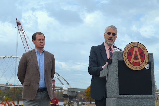 Kenneth Simonson, chief economist for&nbsp;the Associated General Contractors of America, speaks Tuesday in North Little Rock as&nbsp;Thomas Dickinson, incoming president of the Arkansas AGC and general manager of McGeorge Contracting Co. in Little Rock, looks on.&nbsp;