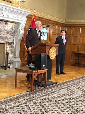 Gov. Asa Hutchinson and and his budget director, Duncan Baird, meet with reporters.
