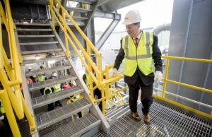 Alan McKim, chairman and CEO of Clean Harbors, tours its new hazardous waste incinerator facility in El Dorado on Dec. 6.