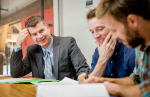 Gary Newton, left, along with Daniel Campbell, center, and Graham Gordy go over the script for their feature film “Antiquities,” which filmed primarily in Arkansas.