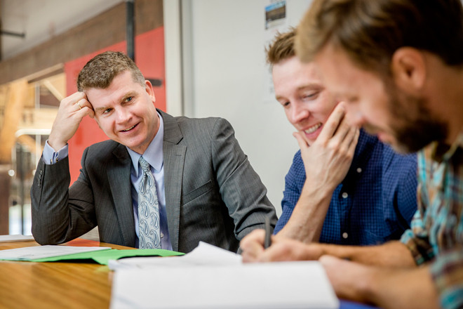 Gary Newton, left, along with Daniel Campbell, center, and Graham Gordy go over the script for their feature film “Antiquities,” which filmed primarily in Arkansas.