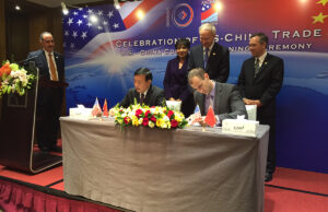 Gov. Asa Hutchinson and AEDC Executive Director Mike Preston meet with officials from Sun Paper in China.