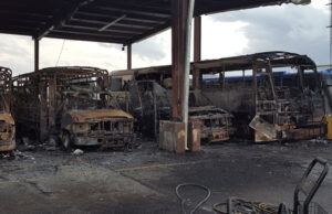 The charred remains after 20 buses burned at a Springdale transit yard.