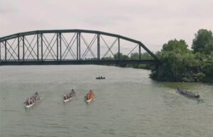 A screen capture from Ascending Impressions' YouTube channel documenting the Fort Smith Dragon Boat Festival as seen from a remote controlled drone.