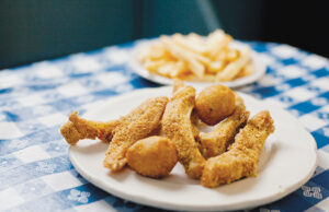 Fried buffalo ribs with hushpuppies and fries at Lassis Inn.