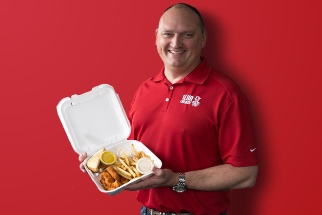 Tom Gordon, CEO and co-founder of Slim Chickens, holds his namesake "Slim's Plate".