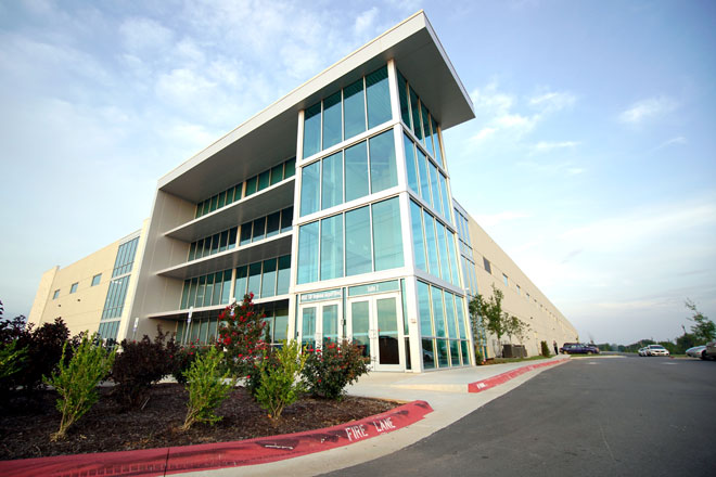 ON THE COVER: The CrossMar Industrial building, a Sage Partners property, at 4901 SW Regional Airport in Bentonville.