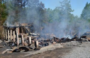 Cotham's Mercantile and restaurant was still smoldering Tuesday, hours after crews responded to an overnight fire at the beloved landmark.