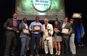 Members of the Grox Industries team accept their first place award at the Donald W. Reynolds Tri-State Collegiate Business Plan Competition Wednesday.