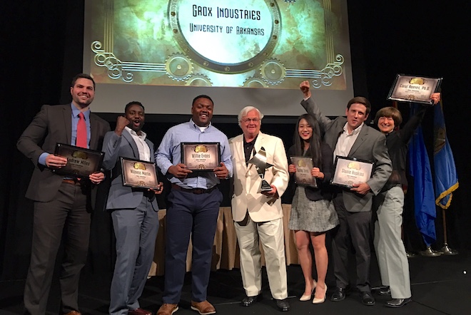 Members of the Grox Industries team accept their first place award at the Donald W. Reynolds Tri-State Collegiate Business Plan Competition Wednesday.