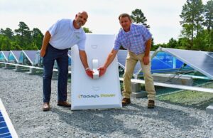 Matt Irvin of Today's Power (left) and Robby Stinnett, manager of system planning at Ouachita Electric Cooperative, at the&nbsp;one-megawatt solar array in Holly Springs.