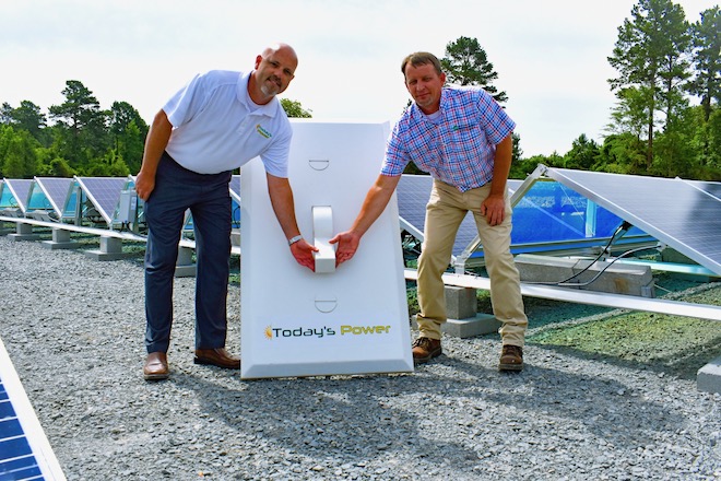 Matt Irvin of Today's Power (left) and Robby Stinnett, manager of system planning at Ouachita Electric Cooperative, at the&nbsp;one-megawatt solar array in Holly Springs.