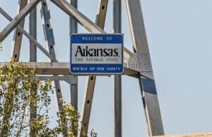 Signs featuring the state's "Arkansas: The Natural State" brand can be found at each major state line crossing, including the Helena Bridge.