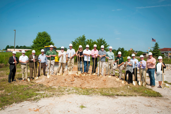 Stone Bank board members, executives and local officials break ground on its new Harrison branch.