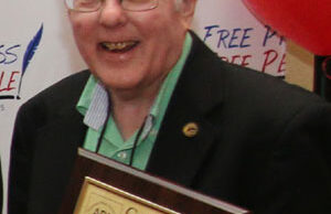 David McCollum accepts his Golden 50 Award from the Arkansas Press Association.