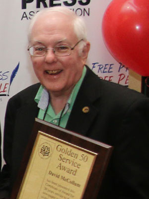 David McCollum accepts his Golden 50 Award from the Arkansas Press Association.