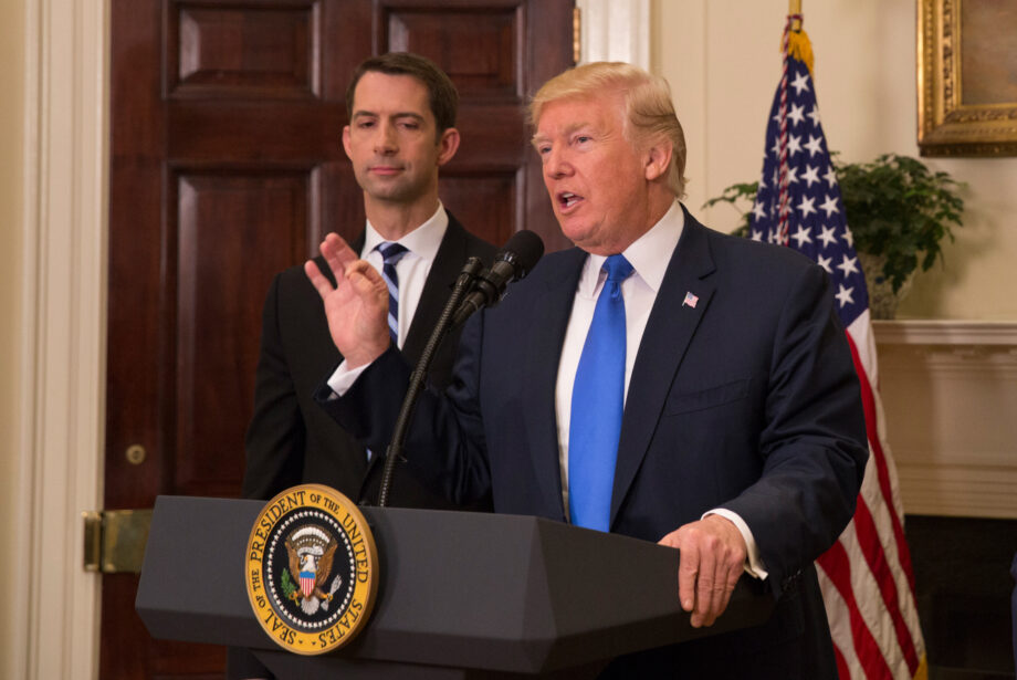 Sen. Tom Cotton, R-Ark., joins President Donald Trump in the Oval Office Aug. 2 to announce a plan to cut the number of visas given to foreign professionals.