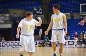 Lakeside High school students Brace Lester (left) and Caleb Dean (right) celebrating after a great play during the AAA State Basketball Tournament’s Unified Champion Schools division game. Unified Champion Schools is an initiative aimed at encouraging inclusion and accepting attitudes in schools using unified sports (a team made up of students with and without intellectual disabilities) as the foundation.