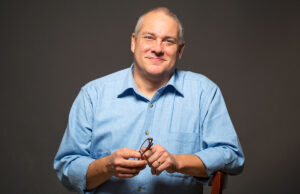 Despite earning a good salary and having health insurance, Ashley Goodwin of Fayetteville, facing cancer, found himself turning to an online fundraising platform to help him pay medical bills.