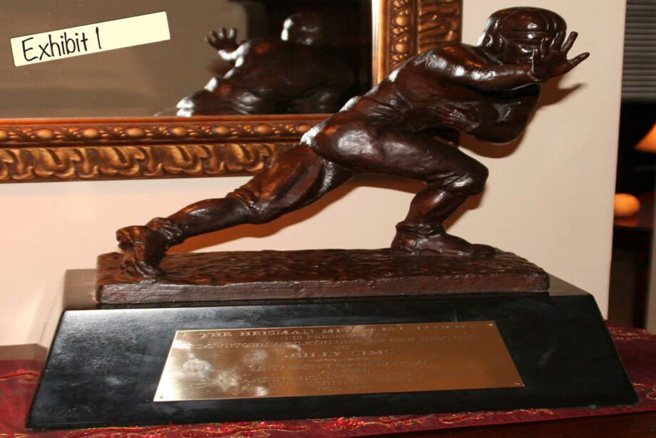 United States v. John Rogers: A sample of bogus sports memorabilia introduced as evidence in the fraud case against Rogers includes a commemorative Heisman Trophy transformed into a counterfeit 1978 Heisman Trophy awarded to Billy Sims.