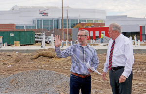 Mayor Joe Smith, right, and communications chief Nathan Hamilton look over the Argenta Plaza site, the mayor’s grand vision for downtown.